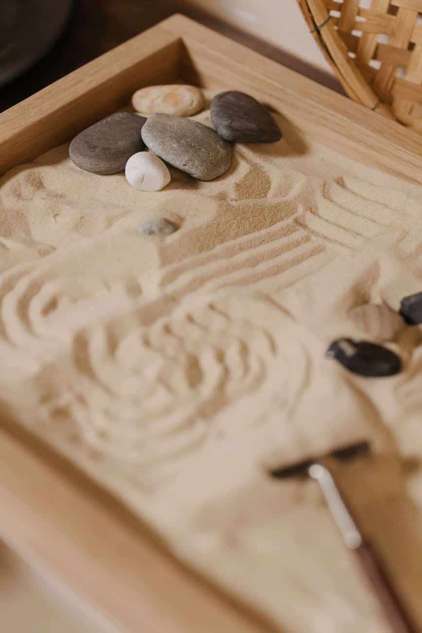 black and white stones on brown wooden table