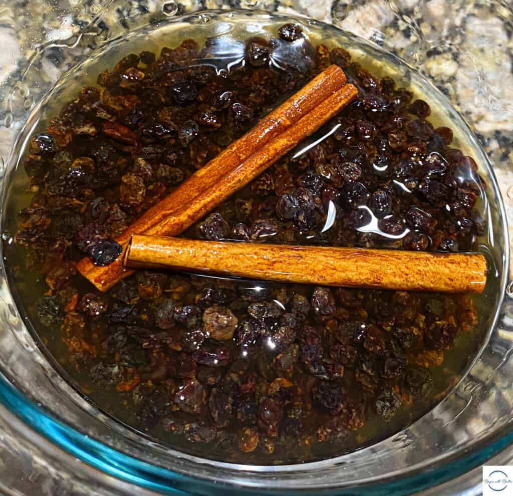 Currants macerating in brandy with cinnamon sticks.
