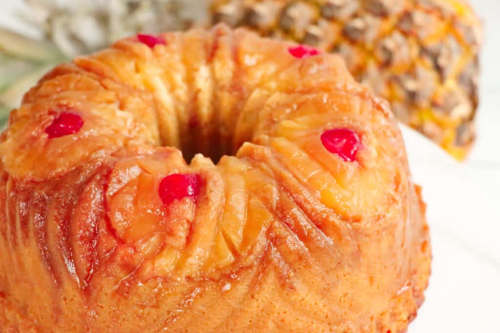 This is a picture of a sliced pineapple upside-down pound cake.