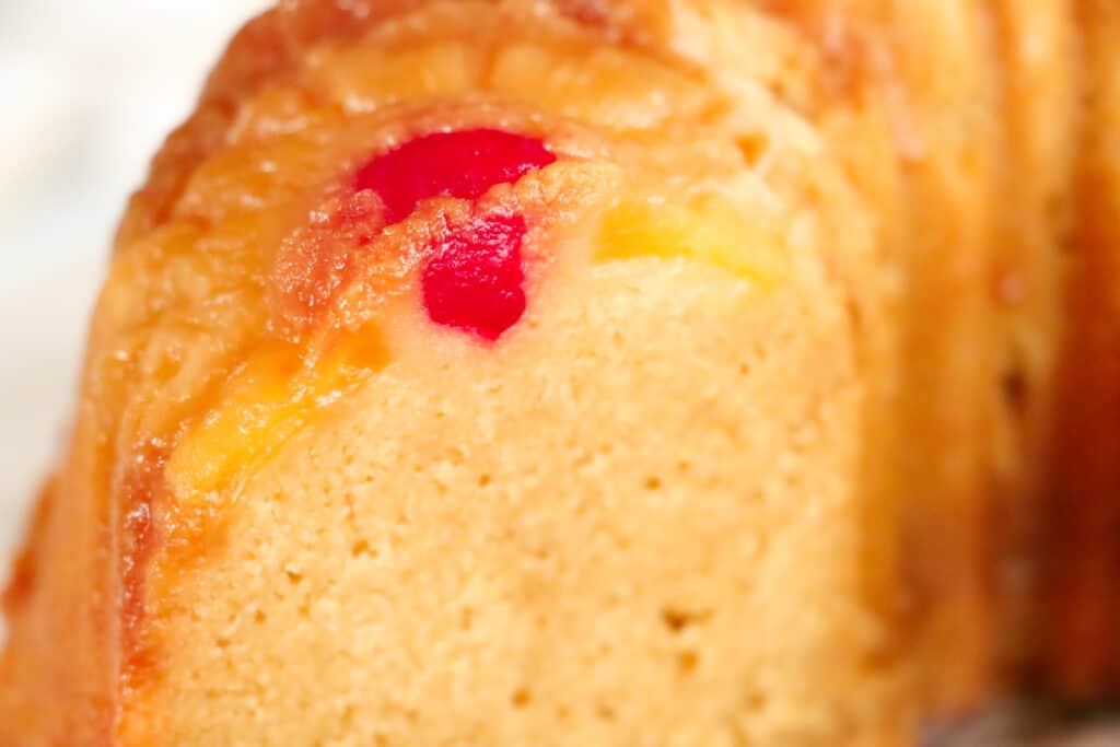 This is a picture of a sliced pineapple upside-down pound cake.