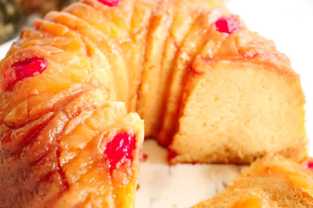 This is a picture of a sliced pineapple upside-down pound cake.