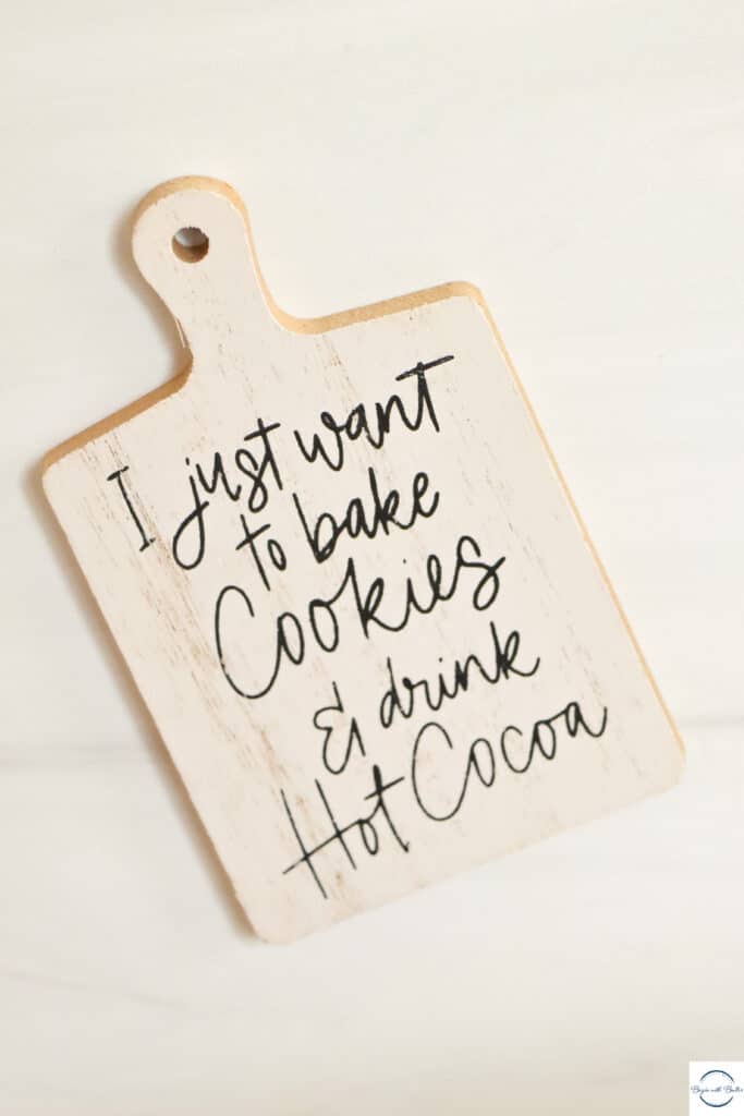 This is a picture of a sign.  The sign reads "I just want to bake cookies & drink hot cocoa."