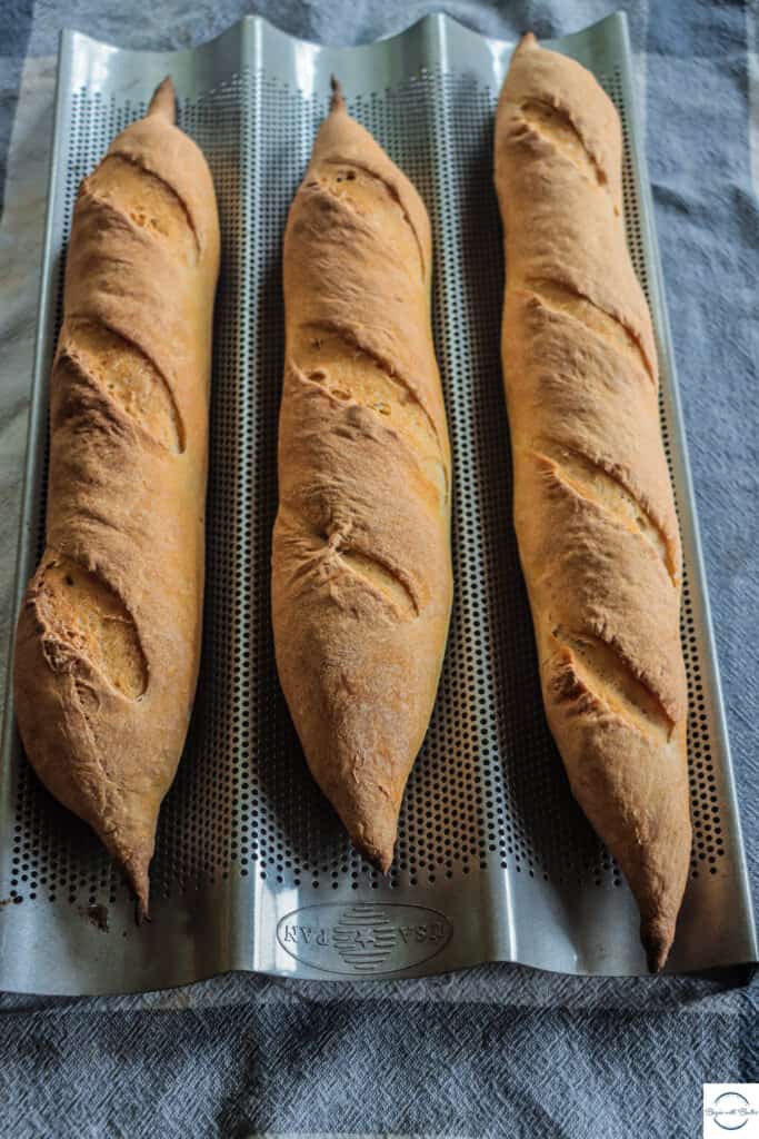 This is a picture of three baguette loaves.
