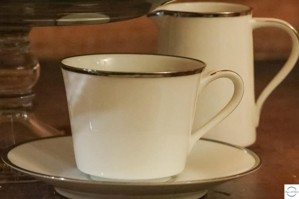 This is a picture of a cup and saucer, and a container for cream.