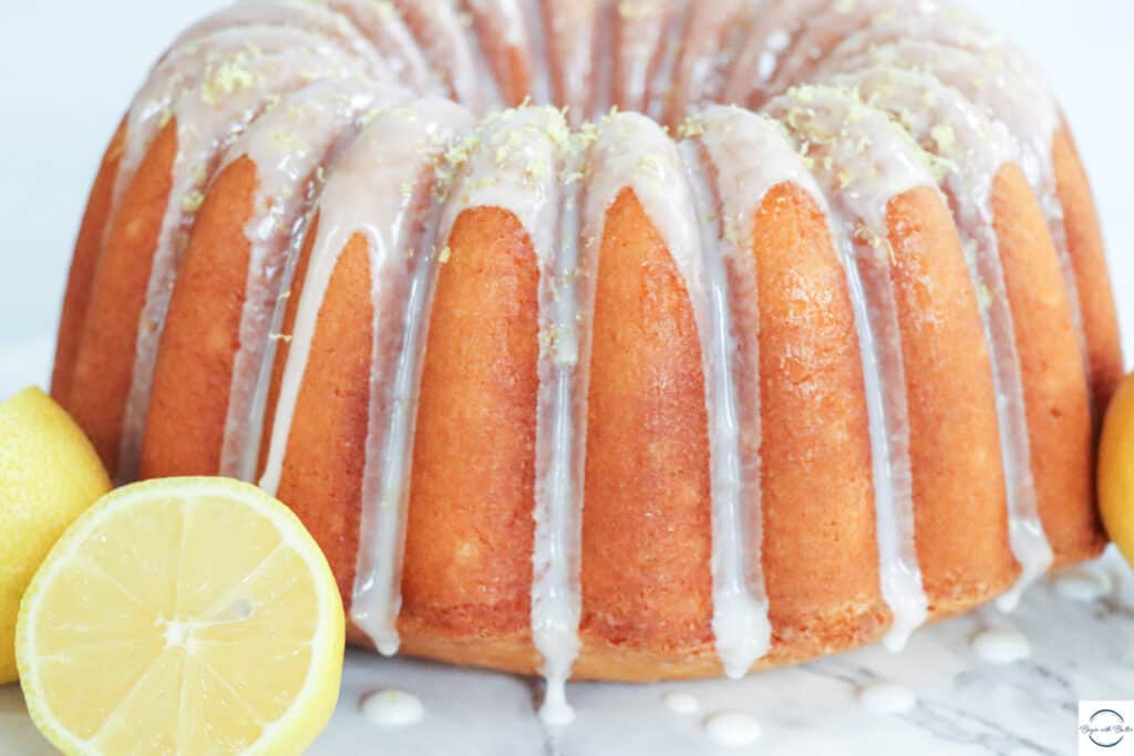 This is a picture of lemon pound cake, surrounded by lemons